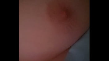 Playing with own nipple